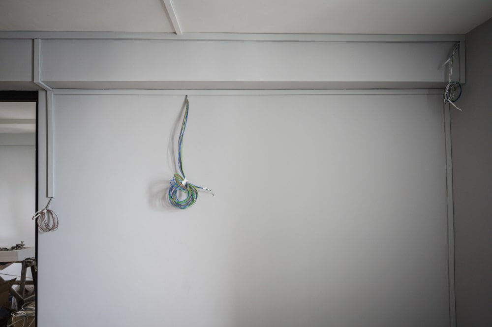 dangling wires on wall